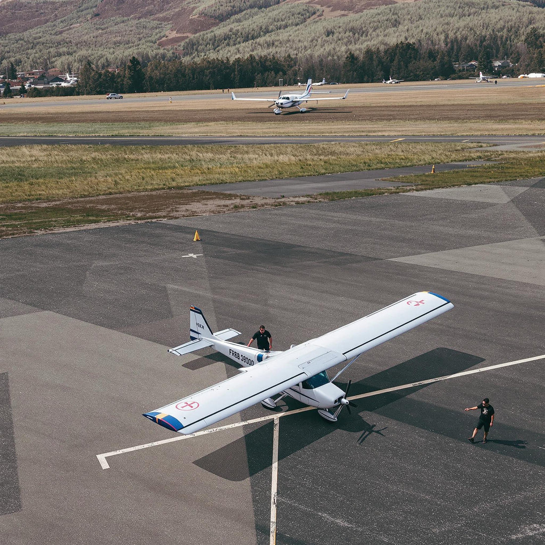 Flight school with student and small aircraft