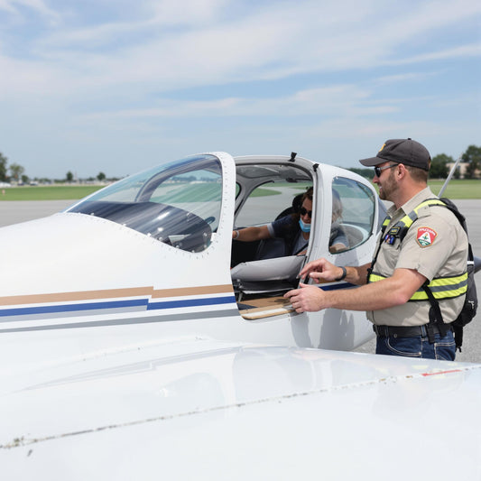 Student pilot with instructor at an aircraft